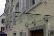 Glasvordach mit Inoxhalterungen